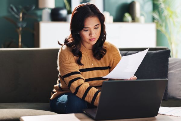 woman on laptop looking into changes to suitability rules for family and private life 2025