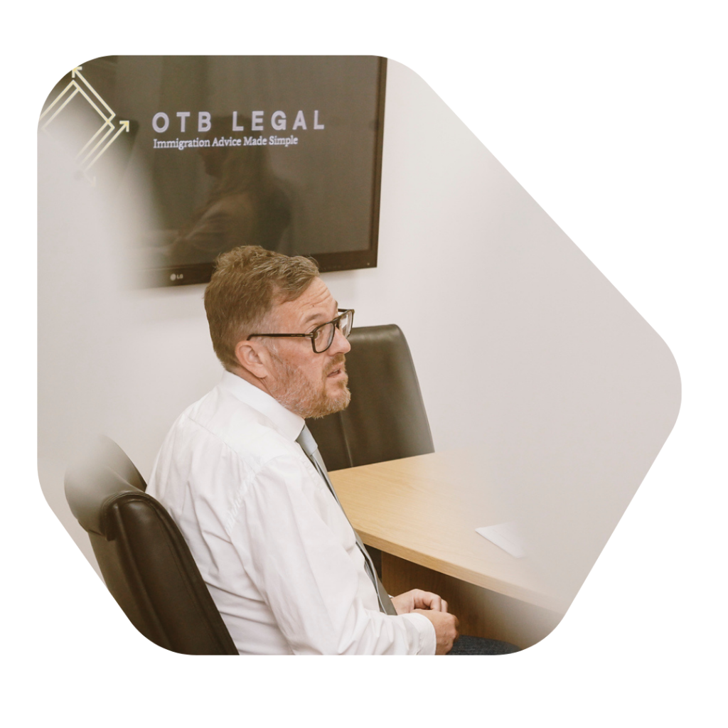 Sponsor Licence Compliance help man at desk working at otb legal