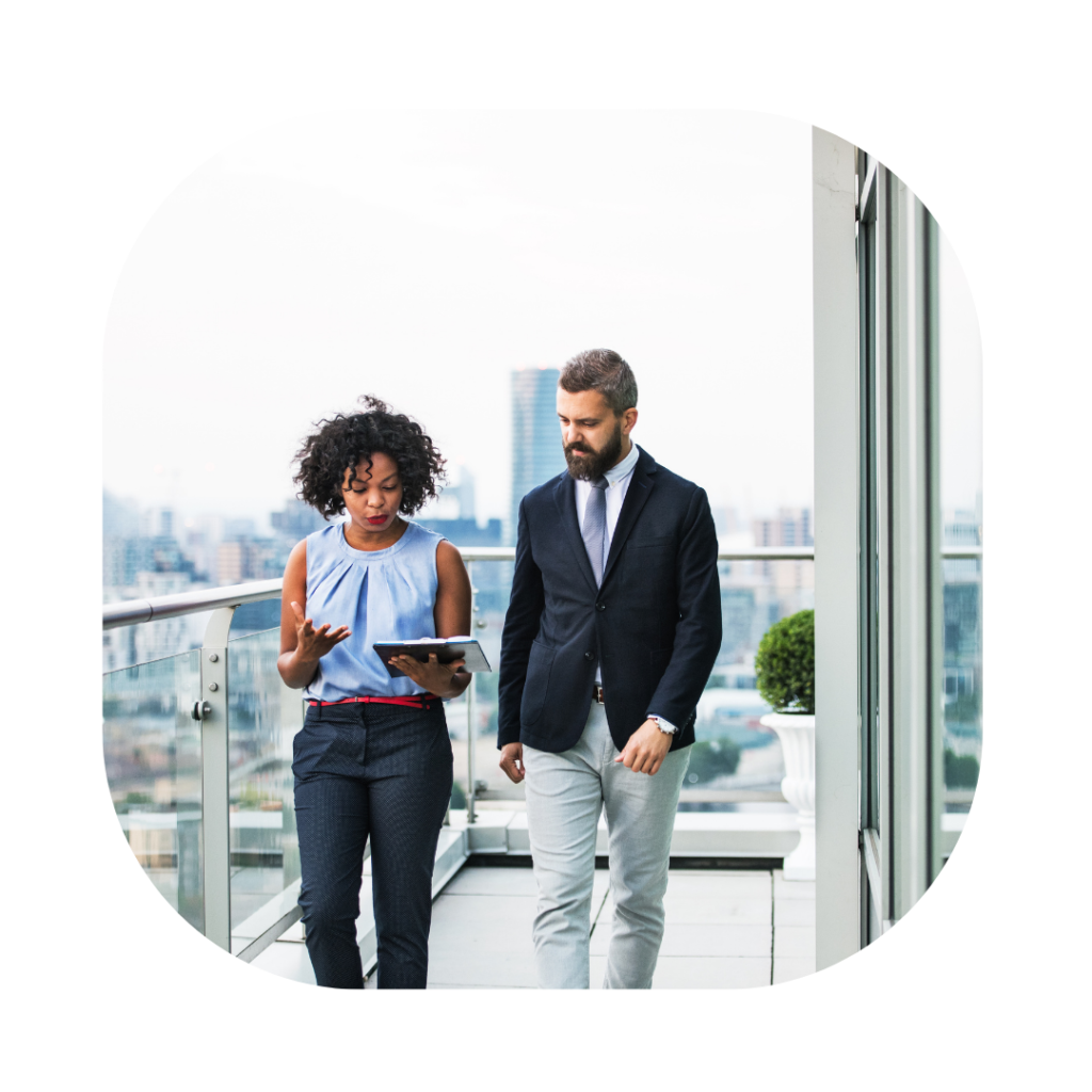 Business woman and man walking. Expansion Worker Visa UK