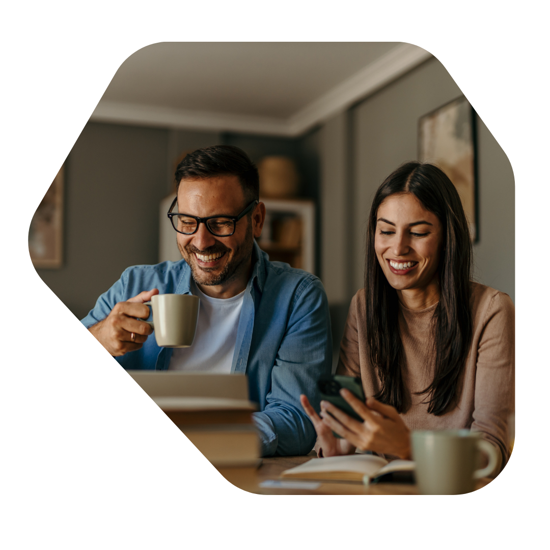 Couple with a cup of coffee applying for a Indefinite Leave to Remain UK Spouse Solicitors OTB Legal