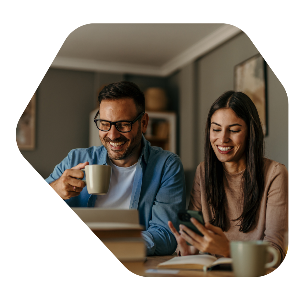 Couple at a laption looking for  Sole Representative of an Overseas Business UK Visa Extension Information